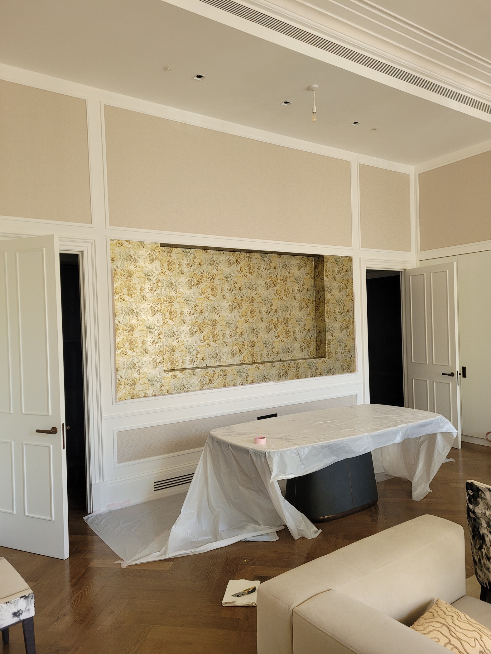 Luxury interior with wall panelling and herringbone floor