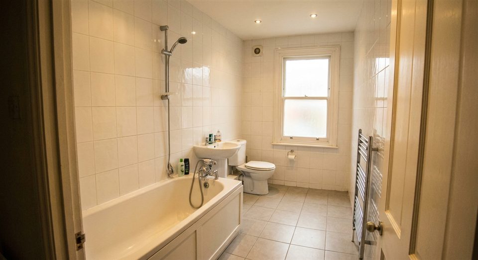 Bathroom after renovation - marble finish, gold taps